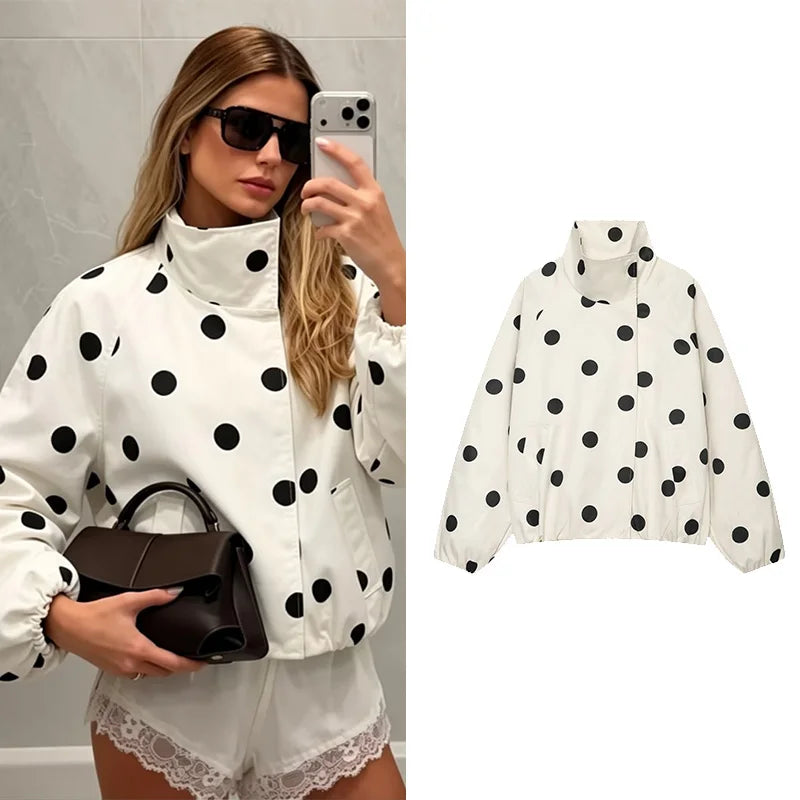 A woman takes a mirror selfie wearing a white puffer jacket with black polka dots, while a clean product image of the same jacket appears on the right against a white background.