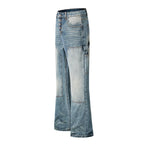 Light blue denim flare jeans with button fly, cargo pockets, and faded patchwork paneling on the front, shown against a plain white background.