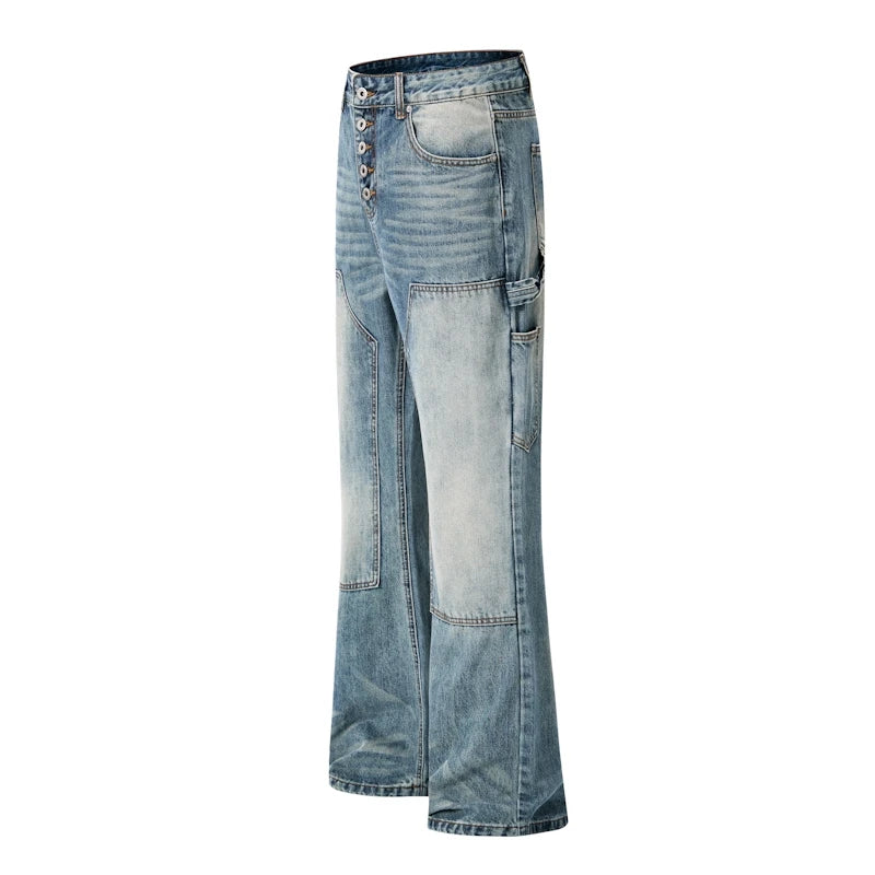 Light blue denim flare jeans with button fly, cargo pockets, and faded patchwork paneling on the front, shown against a plain white background.