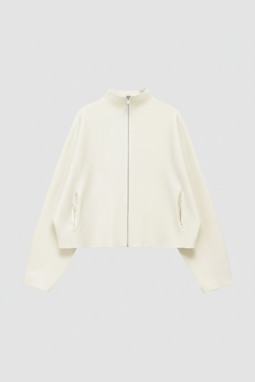 An off-white cropped jacket with a high mock neck, front zipper, and zippered hand pockets, shown against a light gray background.