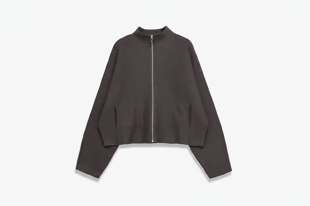 A dark brown cropped zip-up jacket with long sleeves and side pockets, displayed on a light gray background with the brand name TFAFXY in the top left corner.