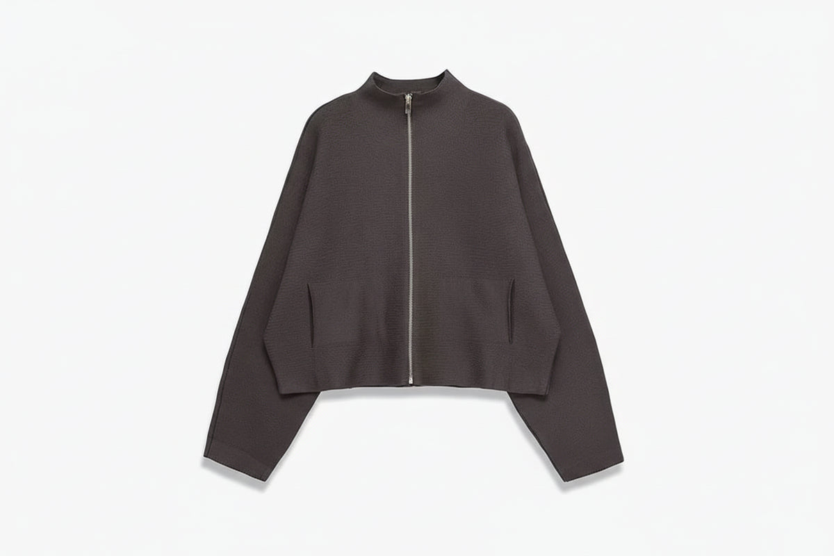 A dark brown cropped zip-up jacket with long sleeves and side pockets, displayed on a light gray background with the brand name TFAFXY in the top left corner.