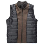 Black puffer vest with brown interior on a white background