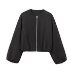 A black cropped zip-up jacket with balloon sleeves and a silver zipper, shown against a plain white background.