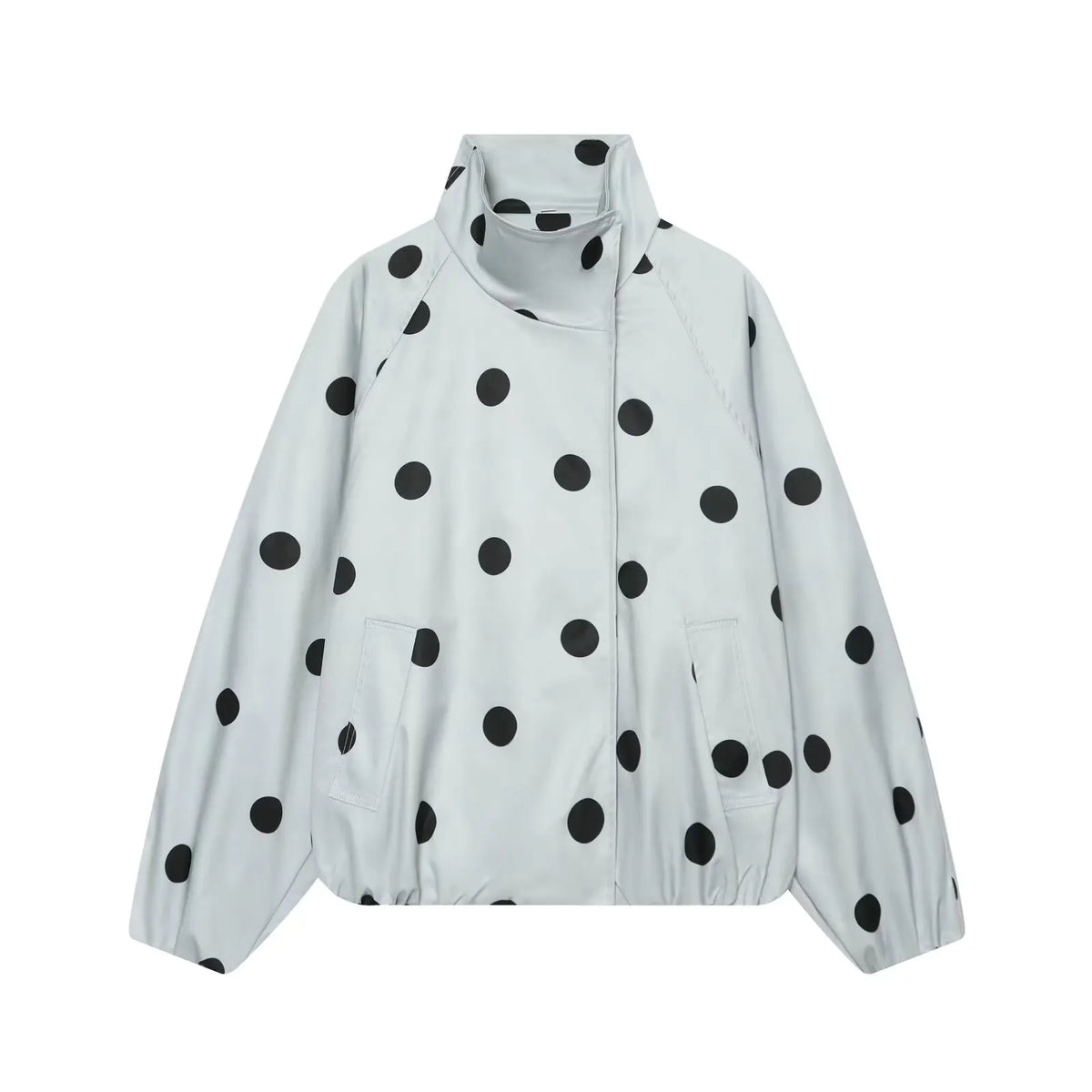 A light gray lightweight jacket with a black polka dot pattern, featuring a stand-up collar, front zipper, and side pockets, shown against a plain white background.