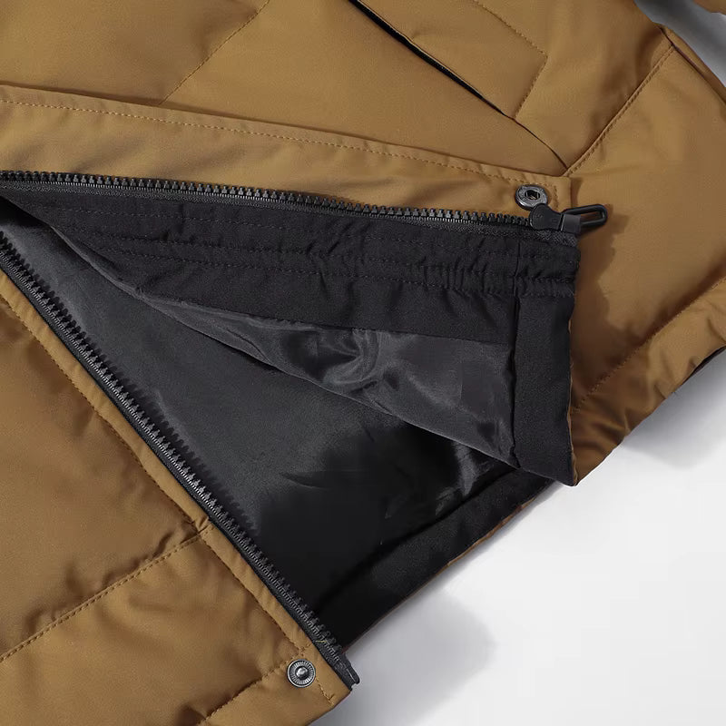 Close-up of a brown jacket with a black zipper on a white background