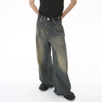 Person wearing wide-leg jeans on a white background