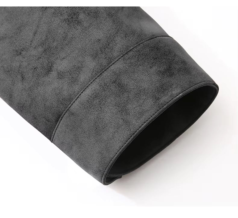 A close-up of a dark gray suede or microfiber sleeve, showing the soft texture and rolled cuff detail on a white background.
