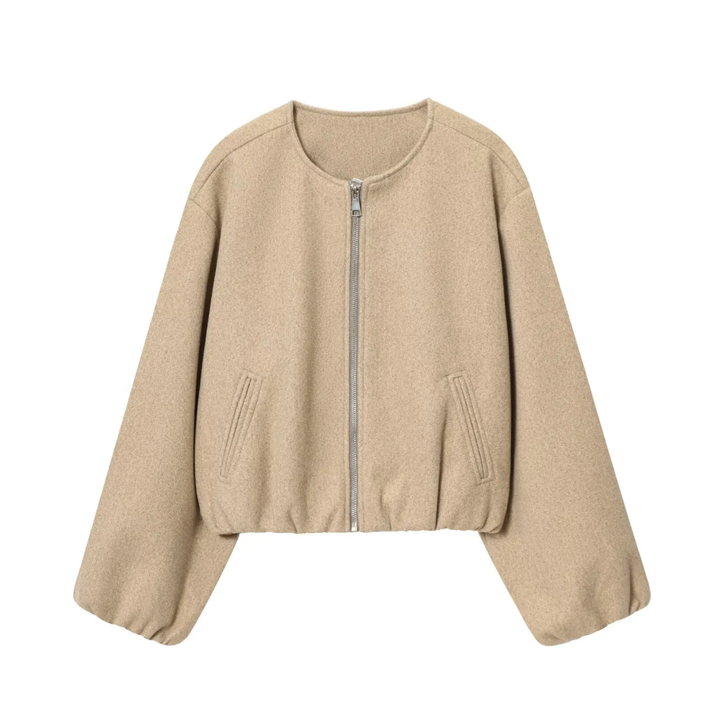 Beige jacket with a zipper on a white background