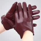 Pair of maroon leather gloves held by a person on a white background, with WOYOUYA branding.