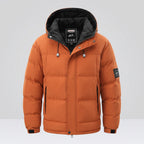 Orange puffer jacket with black hood on a white background, featuring the CHAIFENKO brand.