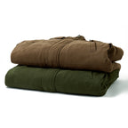 Two folded canvas utility bags stacked on a white background, one in brown and one in olive green.