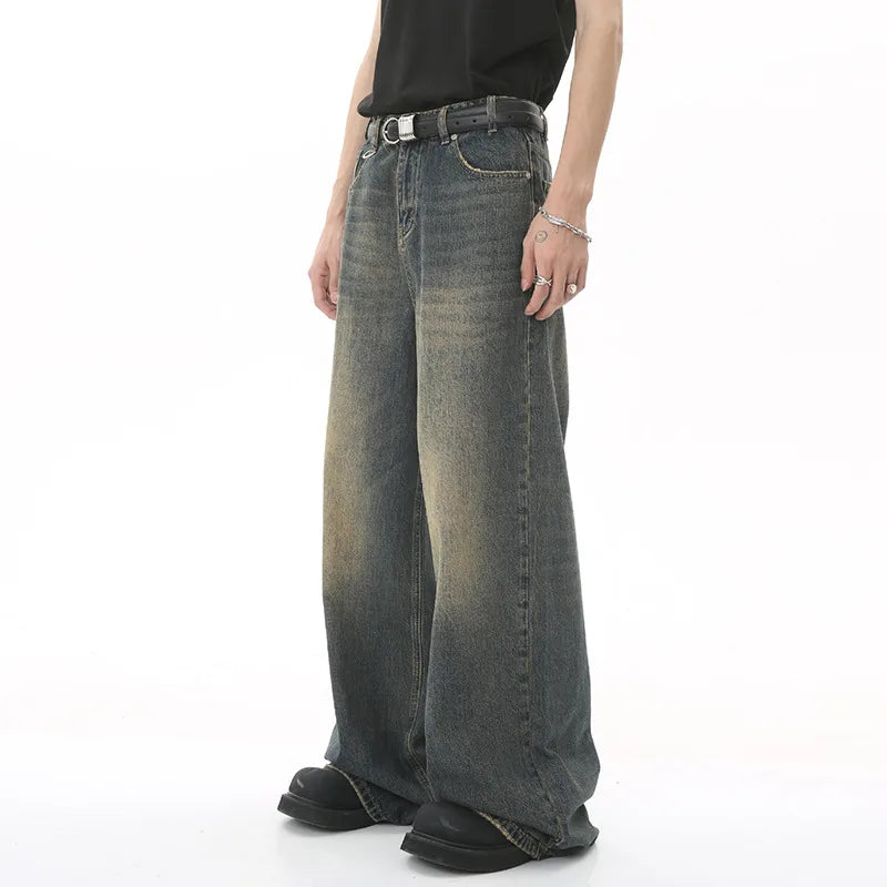 Person wearing wide-leg jeans on a white background