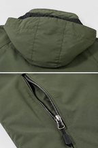 A close-up detail display of an olive green hooded jacket, showing the hood interior and a black zipper with a gold-tone pull.