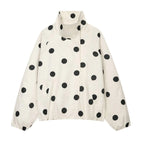 An off-white lightweight jacket with a black polka dot pattern, featuring a high collar and front pockets, shown against a plain white background.