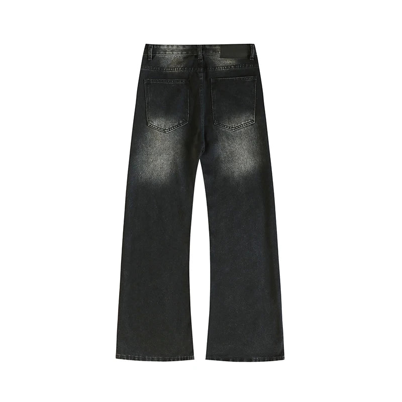 Black distressed jeans on a white background