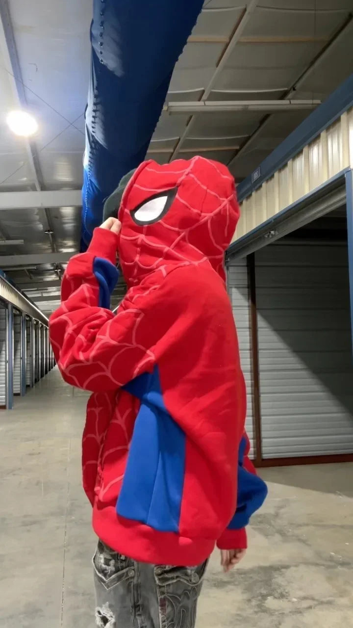 Person wearing a Spider-Man hoodie in an indoor setting