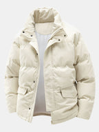 Beige winter jacket with a hood on a light gray background