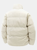 Beige puffer jacket on a white background