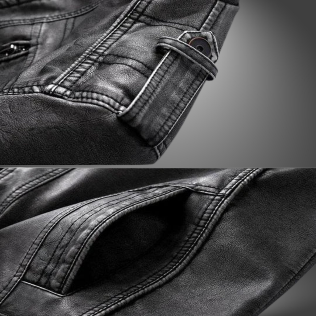 Close-up of a black leather jacket with stitching details on a gray background