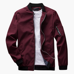 Maroon jacket with black trim on a white background