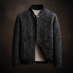 Dark gray leather jacket on a dark background