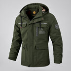 Green winter jacket with a blurred snowy background