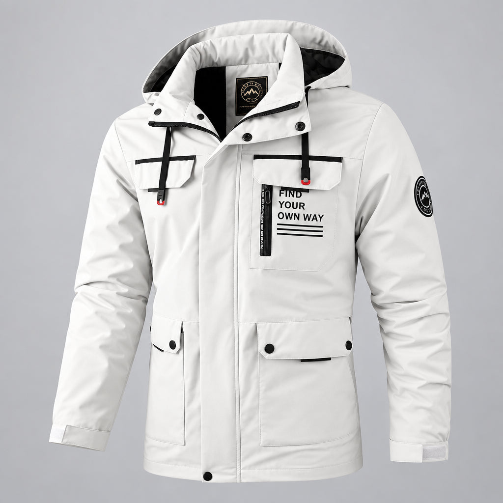 A men's hooded winter parka jacket in off-white with black trim, front zipper and snap closure, flap chest pockets, and printed text on the chest pocket reading 'FIND YOUR OWN WAY'. The jacket is shown against a blurred icy mountain background.