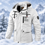 A white hooded winter parka jacket with black trim, front zipper, flap pockets, and printed text on the chest pocket, shown against a snowy outdoor-style background.