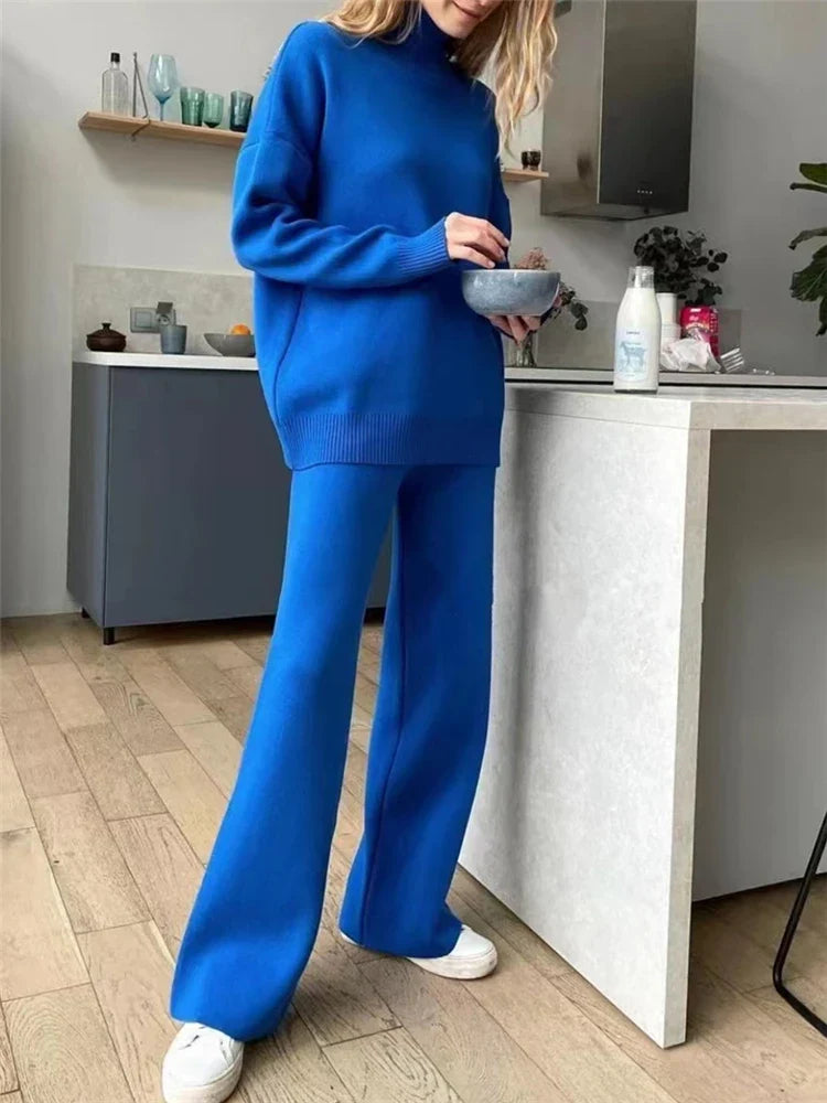 Person wearing a blue outfit in a kitchen setting