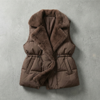 Brown puffer vest with fur trim on a gray background