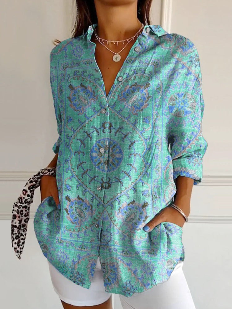 Woman wearing a green patterned shirt with a white background