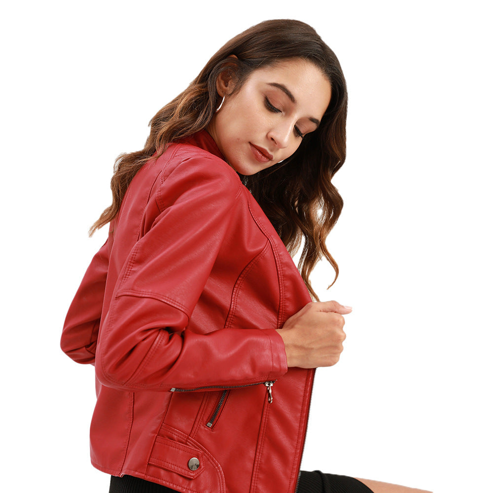 Woman wearing a red leather jacket on a white background