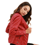Woman wearing a red leather jacket on a white background