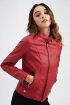 Woman wearing a red leather jacket on a white background