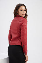 Woman wearing a red leather jacket on a white background