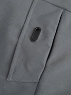 Close-up of a gray fabric with a button on a garment