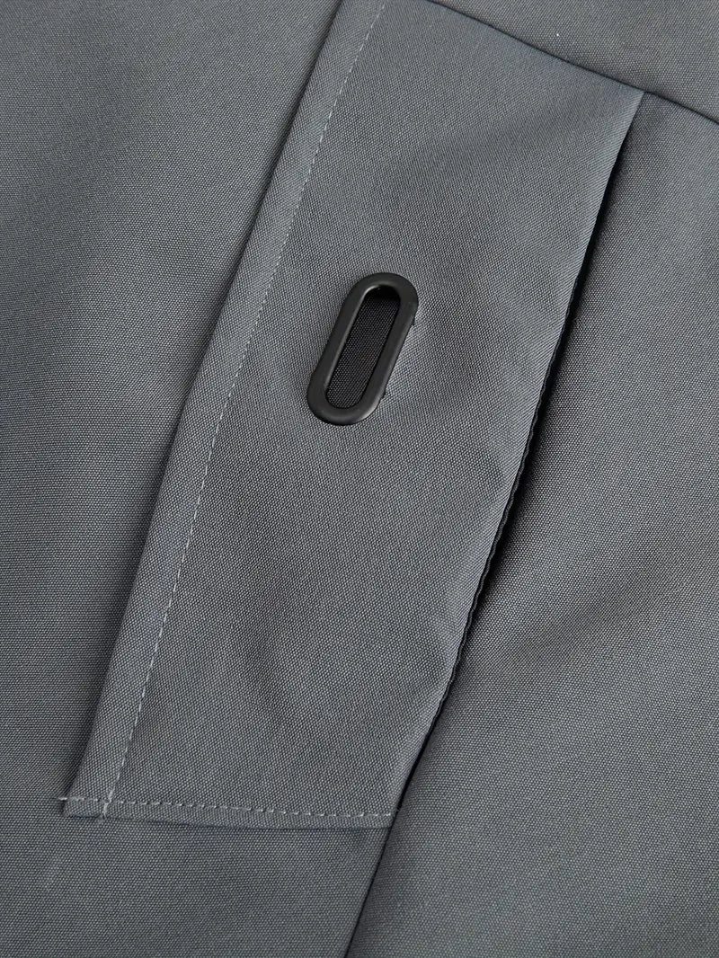 Close-up of a gray fabric with a button on a garment