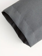 Close-up of a folded gray fabric on a white background