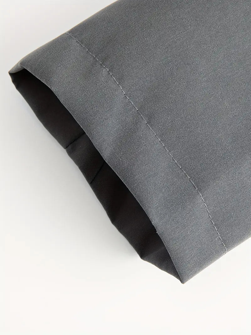Close-up of a folded gray fabric on a white background