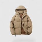 Beige puffer jacket with a hood on a light gray background