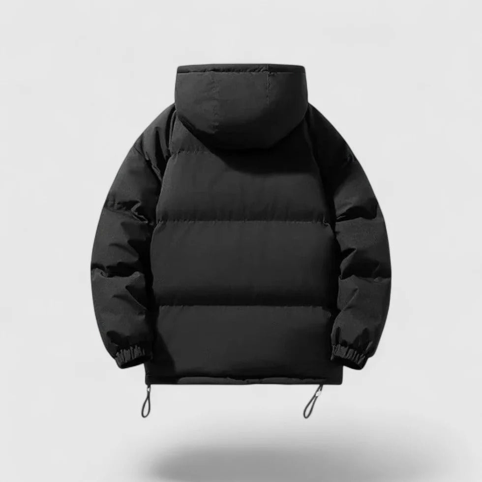 Black puffer jacket on a light gray background