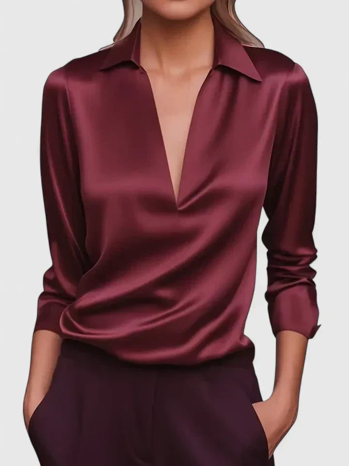 Maroon satin shirt worn by a model on a plain background
