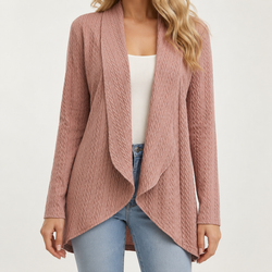 A woman wearing a dusty rose cable-knit open-front cardigan over a white top and light blue jeans, shown from the neck down against a plain light background.
