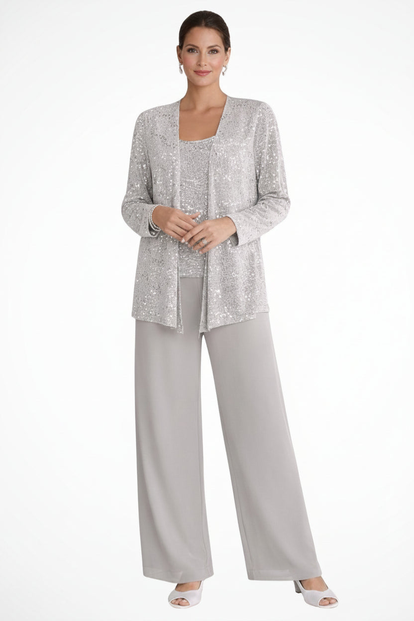 Woman wearing a gray outfit with a matching jacket on a white background