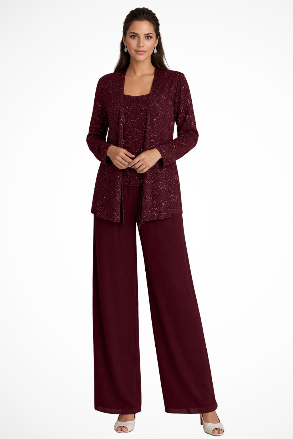 Woman wearing a burgundy pantsuit on a white background