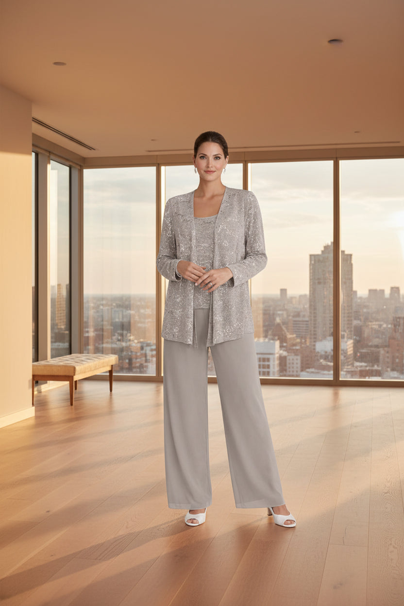 Woman wearing a gray pantsuit on a white background